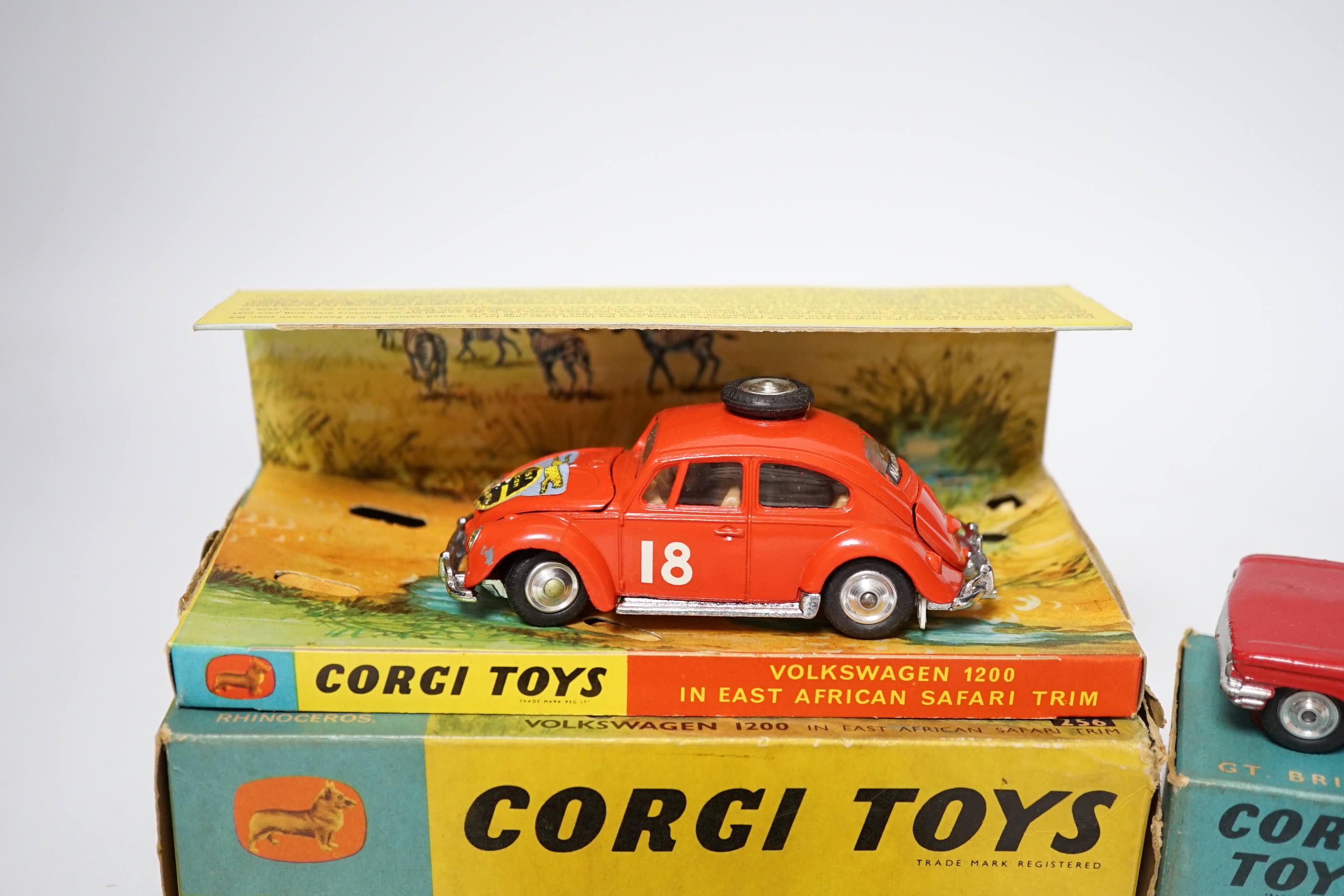 Three Corgi Toys including (256) Volkswagen 1200 in East African safari trim (with rhino and inner display stand), (437) Cadillac Superior Ambulance, both boxed, together with an unboxed Commer three-quarter ton police v